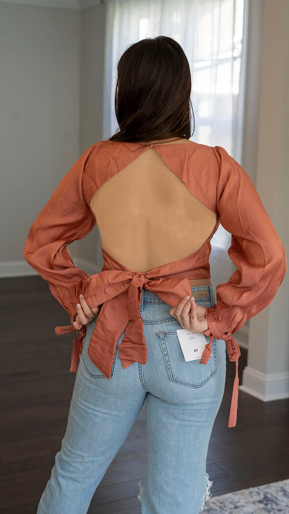 Back view - Long sleeve coral crop top with sweetheart neckline, tie-back and wrist tie detail